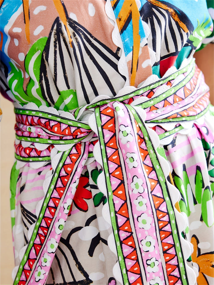 Abito estivo midi tropicale da spiaggia con scollo a rever per donna