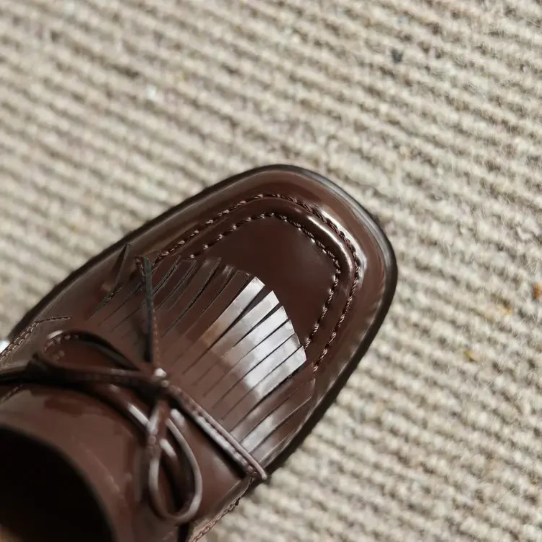 Mocasines con tacón bloque y borlas