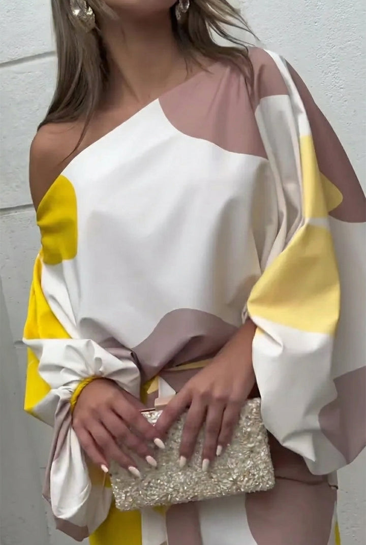 Conjunto midi con flecos y un solo hombro