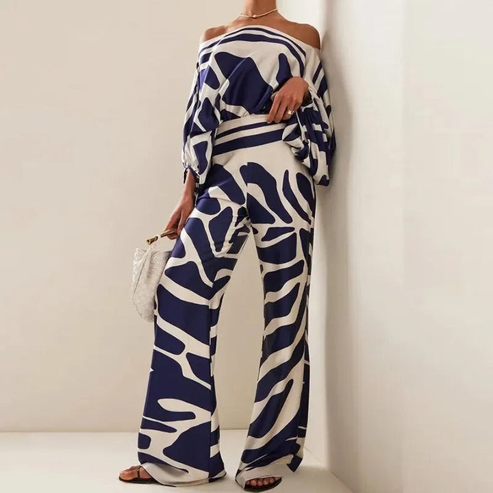 Conjunto de pantalones anchos y top estampado con hombros descubiertos
